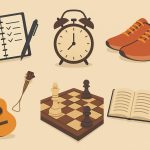 Colorful flat lay of journaling supplies, running shoes, guitar, chessboard, paints, and a book